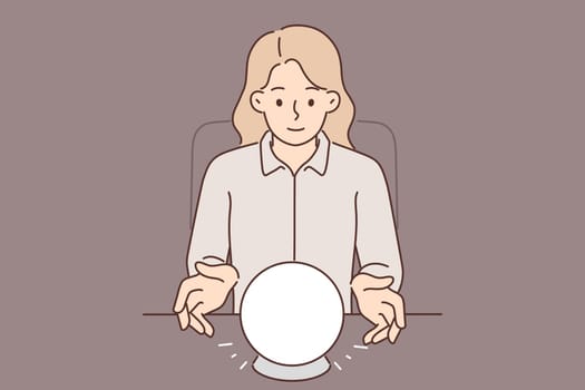 Woman uses crystal ball to predict future during seance and provide psychic services