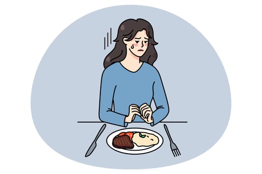 Unhappy woman sit with dish plate suffer from eating disorder