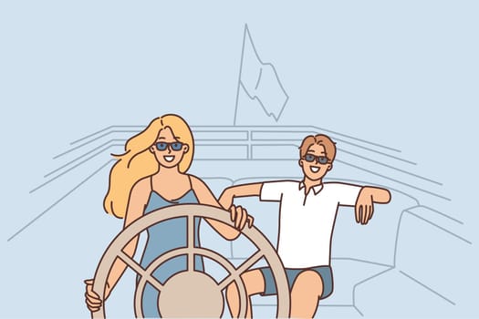 Couple in love rides on yacht spending honeymoon on luxury voyage by sea or ocean
