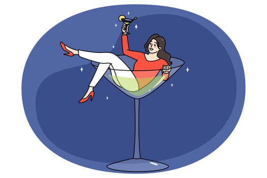 Smiling woman lying in martini glass