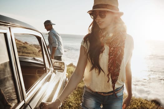 Summer road trip vibes. a young couple enjoying a road trip along the coast.