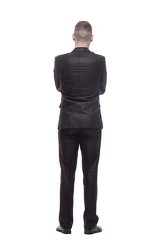 rear view. handsome young businessman. isolated on a white