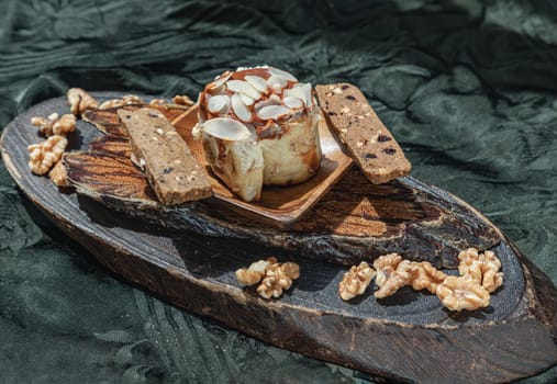 Thai milk tea Almond Minibon served with Stick cookies and Walnuts on wooden.