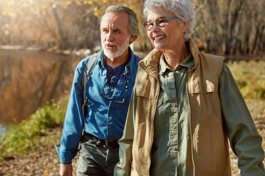 Retirement - a time to explore more. a happy senior couple exploring nature together.