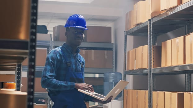 African american worker counting products on shelves