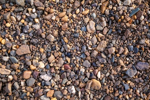 Background of small pebbles and stones on the seashore or in garden