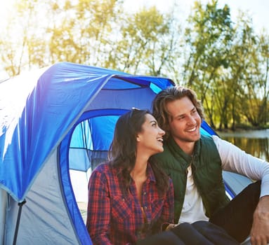Happiness is camping with your significant other. an adventurous couple out camping together.
