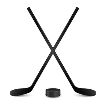 Two crossed hockey sticks and puck. Isolated on white