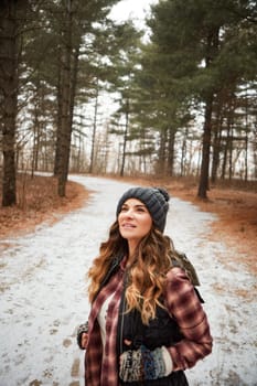 Wandering through winter. a young woman hiking in the wilderness during winter.