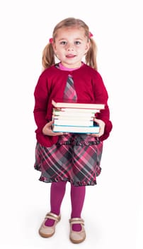 Education concept. An inquisitive child. Little girl with books getting ready to go back to school
