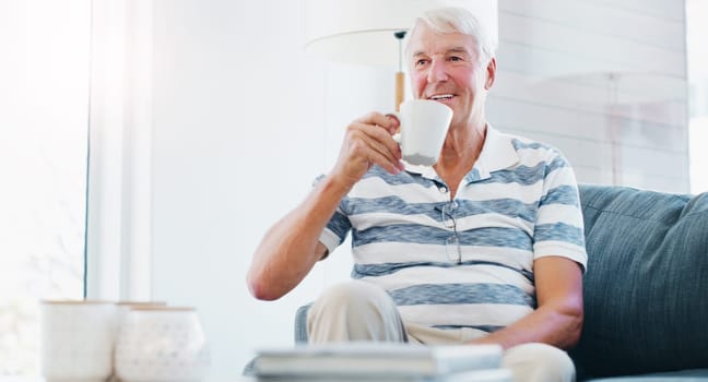 Take a sip from the comfy life. a senior man relaxing with a cup of coffee on the sofa at home.