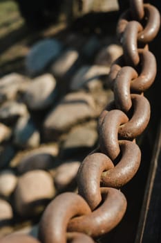 Old rusty metal chain outdoors. Large chain links