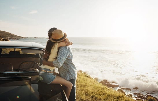 The best roads lead to romance. an affectionate young couple enjoying a road trip along the coast.