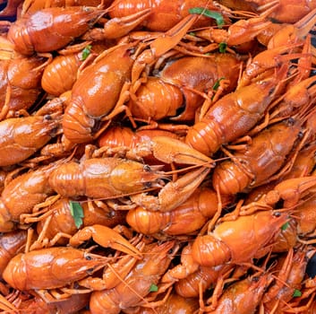 top view of cooked crawfish with lemons and spices