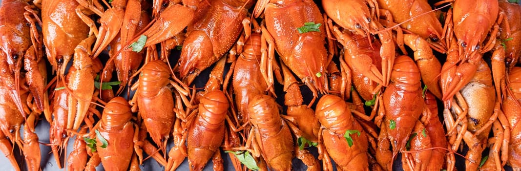 top view of cooked crawfish with lemons and spices