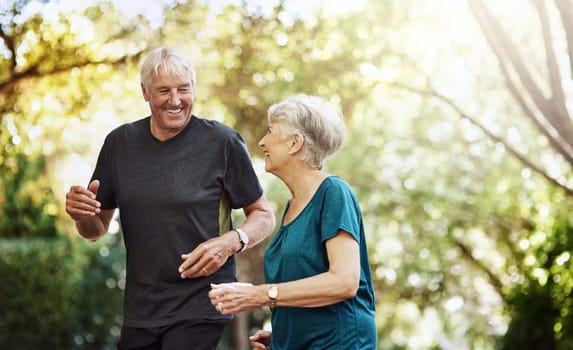 Fitness automatically gets them into the best mood. a senior couple out for a run together