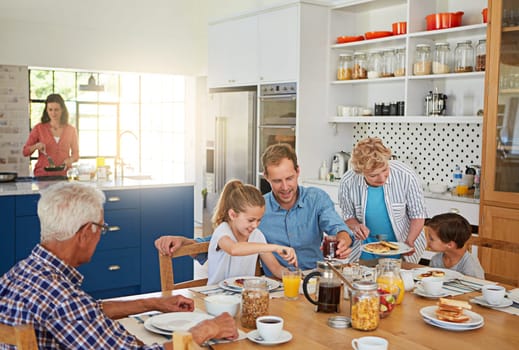 Every mealtime is family time. a multi generational family enjoying breakfast together at home.