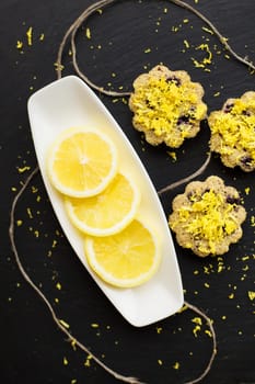 lemon cupcakes on a black background