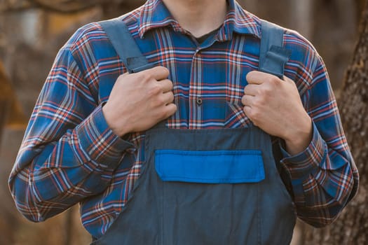 Farmer's or Gardener's Clothing Appearance Fashion Blue Shirt Patterned Checkered Jumpsuit Hands Overalls