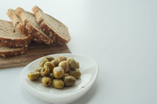 breads and Turkish Grilled olives on white background