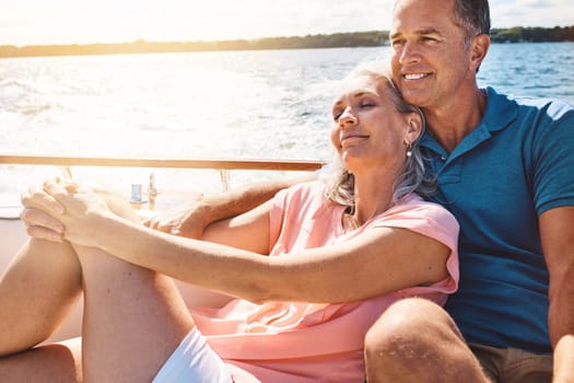 Love floats a boat. a mature couple enjoying a relaxing boat ride.