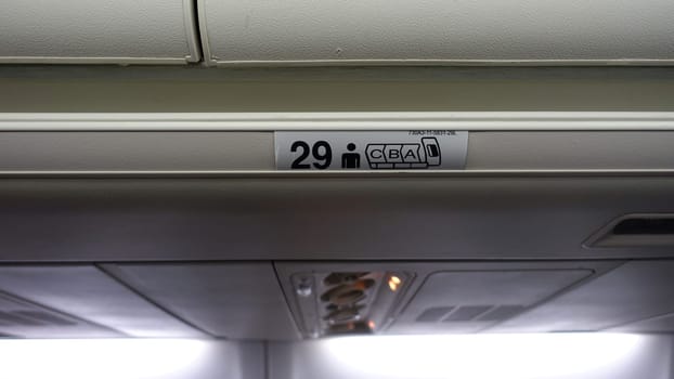 Sign indicating seating in an aircraft.