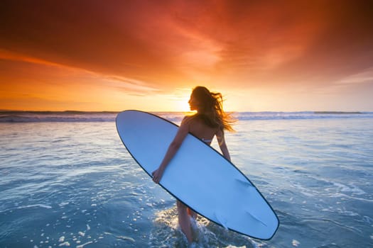 Woman with surfboard