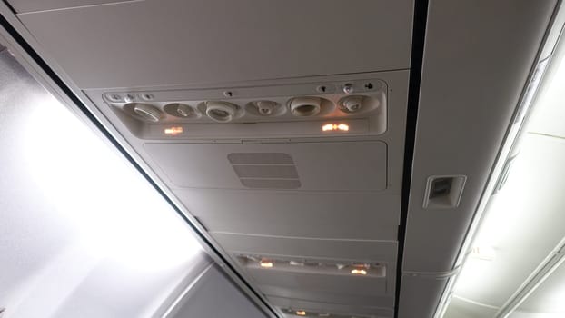 Detail of the ceiling of the interior of an airplane.