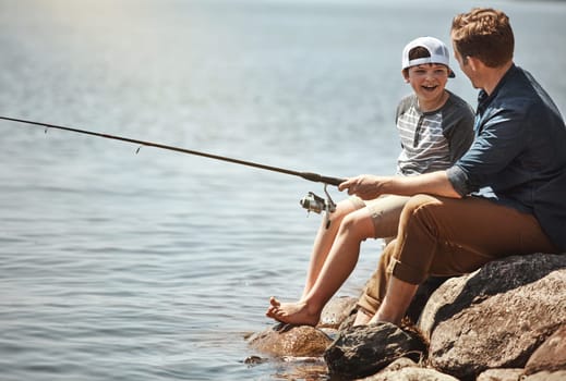 Maybe well catch a shark too. a father and his little son fishing together.
