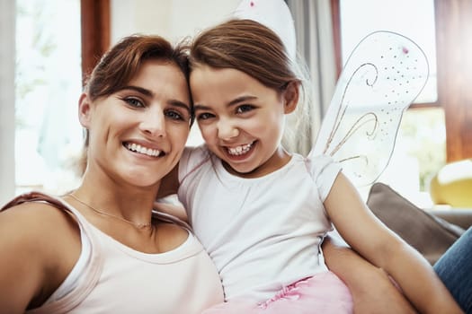 Bright family moments. Portrait of a mother and her little daughter bonding together at home
