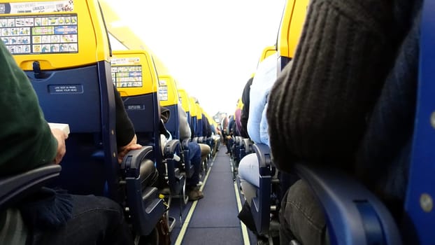 Rome, Italy, March 12 2023. The corridor inside an airplane.
