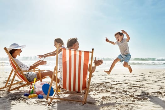 Nothing but carefree fun in the sun. a family enjoying some quality time together at the beach.