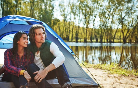 Its the ultimate escape. an adventurous couple out camping together.