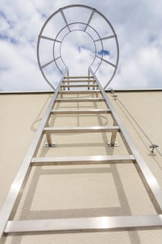 View from below of the technical ladder leading to the building's roof.