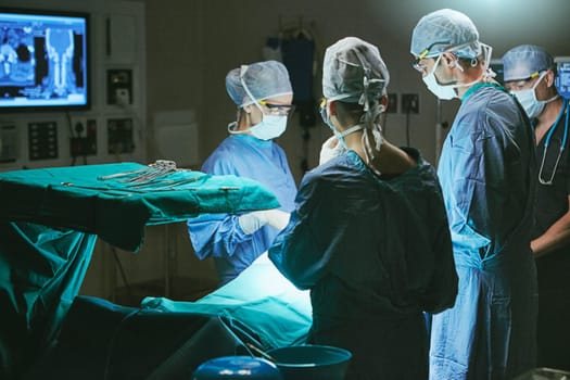 Making a difference in the lives of their patients. surgeons in an operating room.