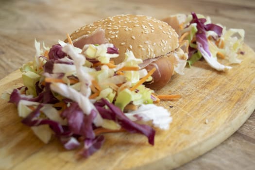 sandiwich with raw ham and salad