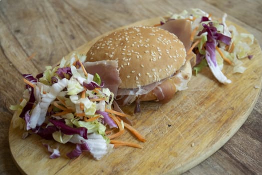sandiwich with raw ham and salad