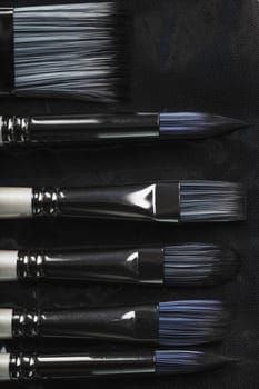 A set of art brushes for drawing on a black background