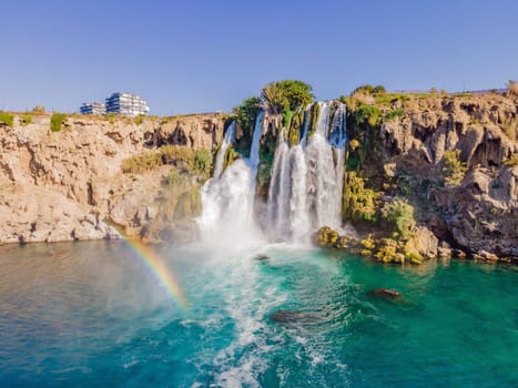 Lower Duden Falls drop off a rocky cliff falling from about 40 m into the Mediterranean Sea in amazing water clouds. Tourism and travel destination photo in Antalya, Turkey. Turkiye.