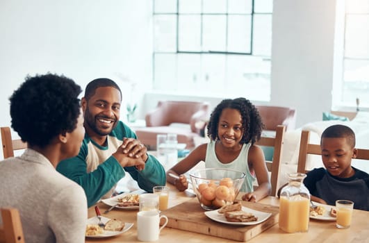 Wake up to the smell of breakfast with your family. a family having breakfast together at home.