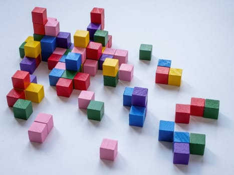 Abstract structure of colored cubes as a symbol of complex interaction.