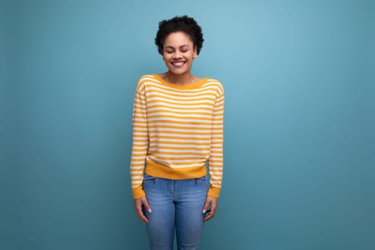 optimistic latin young woman with afro hair smiling joy
