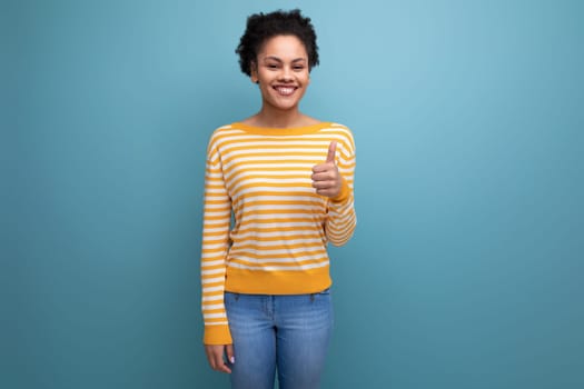 optimistic latin young woman with afro hair smiling joy