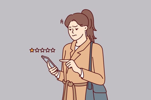 Woman with phone shares user experience by giving negative rating to store or restaurant