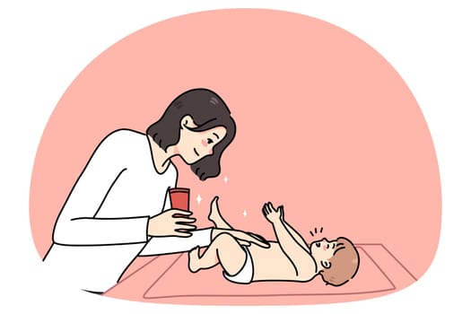 Caring mom moisturize newborn baby body