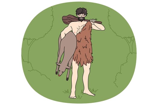 Caveman in tribe clothing hold prey