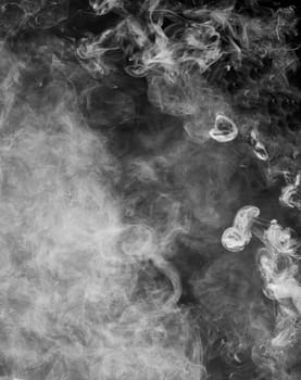 Puffs of smoke on a black background