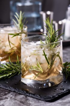 The Rosemary Vodka cocktail consists of maple syrup with a small amount of salt, rosemary, crushed ice and vodka. Vodka can be replaced with other alcohol - tequila, white rum, gin.  