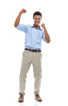 Celebrating success. Studio portrait of a young man with his arms raised in celebration isolated on white.