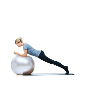 Gym keeps your body and your mind in top shape. a female balancing on an exercise ball with a white background.